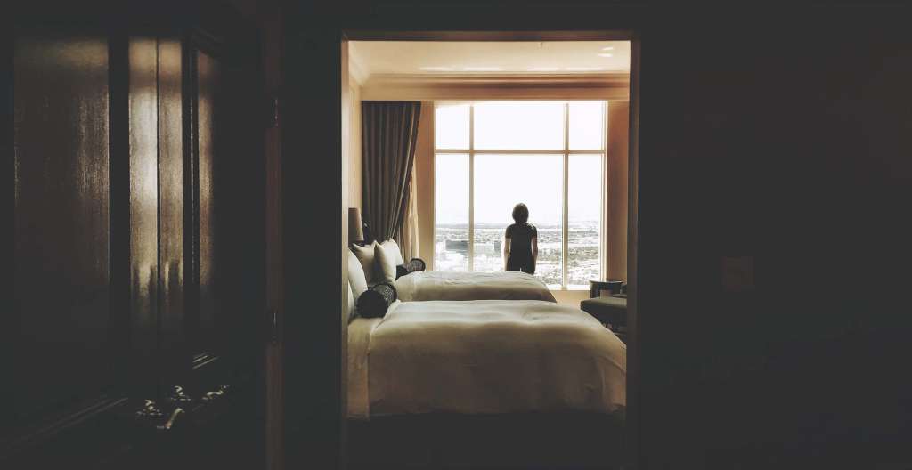 Figure in a hotel room